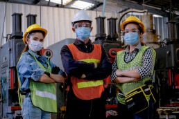 practicing employee safety with protective masks