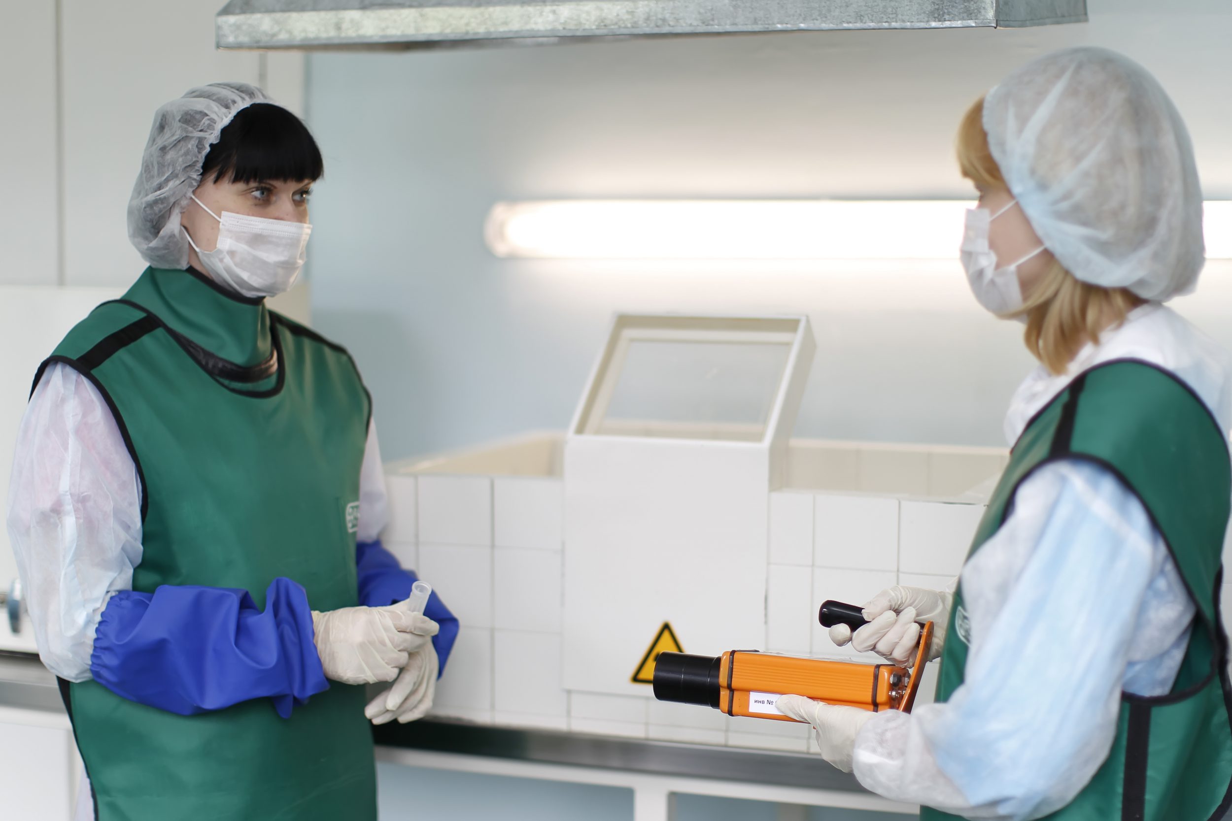 Nurses prepare radioactive iodine for the treatment of thyroid cancer.