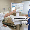 CyberMed PX24 in Hospital with Patient Touching Screen Thumbnail